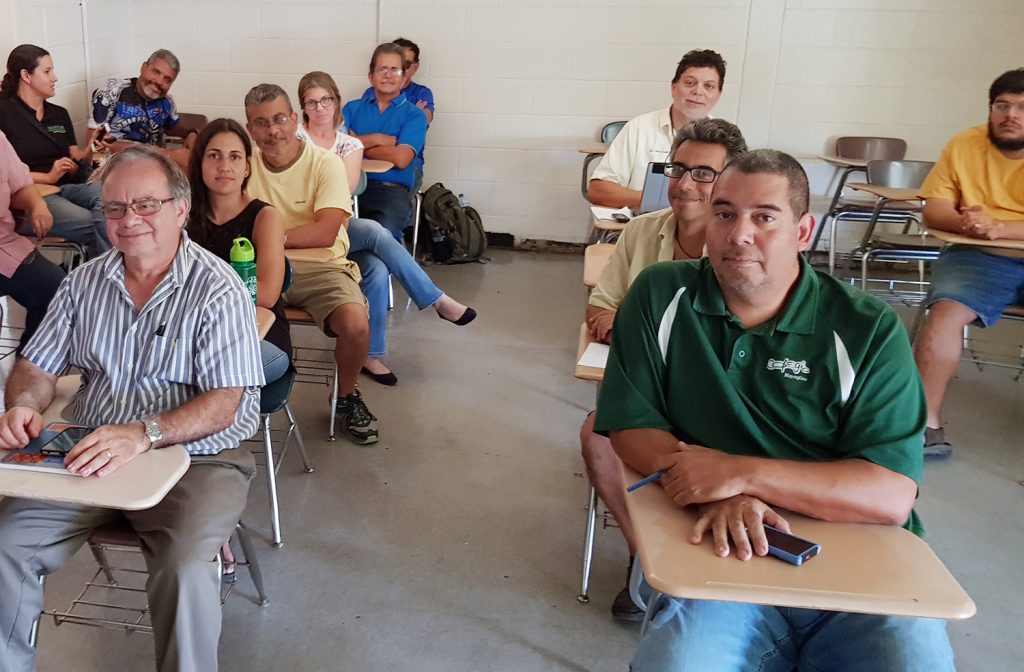 UPR-M employees and faculty gathered for a planning meeting shortly after the storm came through Puerto Rico planning. Shown at the front left is Prof. Ricardo López. Photo by Ismael Pagán-Trinidad.