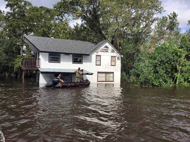 Soldiers with Florida National Guard's 20th Special Forces Group go door to door in the Jacksonville area around Ortega Island following Hurricane Irma (2017). Photo from the Florida National Guard.